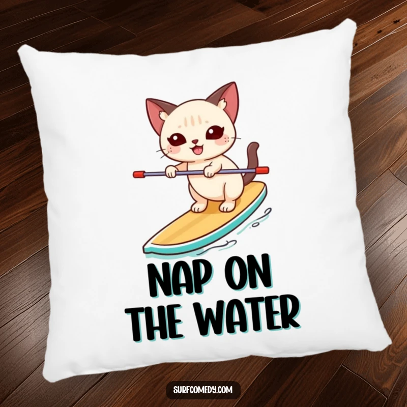 Funny Siamese cat happily balancing unsteadily on a paddleboard on a decorative pillow, offering comfort and a humorous display of water fun.