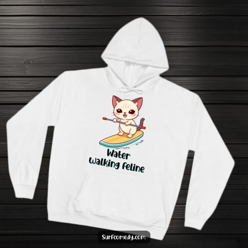 Funny Siamese cat balancing unsteadily but happily on a paddleboard on a cozy hoodie, radiating joy and outdoor spirit.