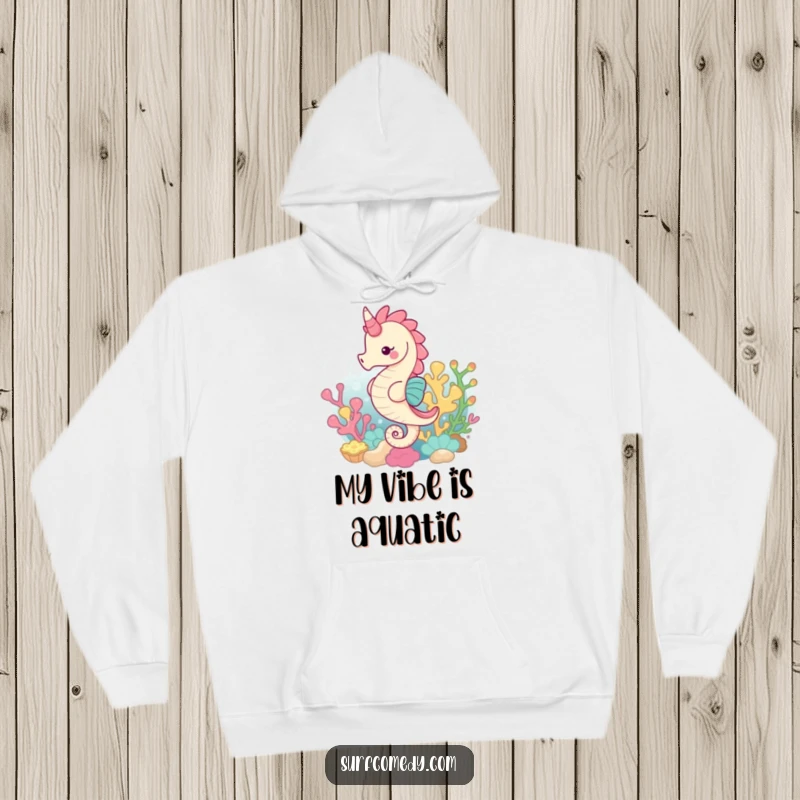 Funny hoodie showcasing a cute kawaii seahorse gracefully swimming through a colorful and intricate coral reef.