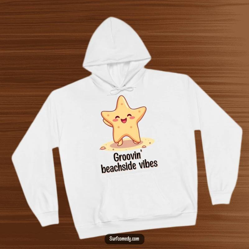 Funny hoodie showcasing a cute kawaii starfish doing a happy dance on a sandy beach, radiating warmth and cheer.