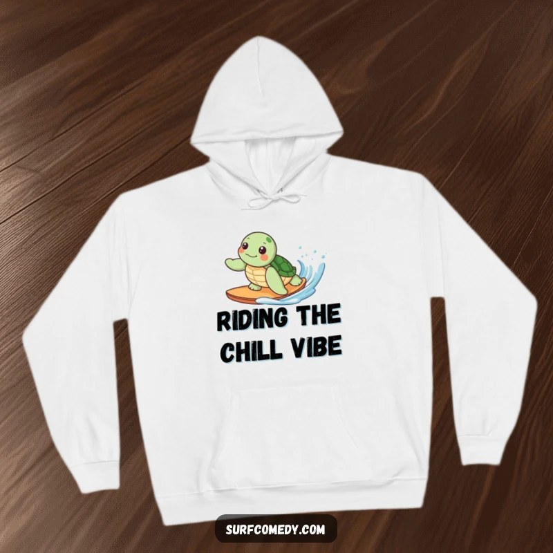 Funny hoodie depicting a cute kawaii sea turtle character happily surfing a gentle wave, symbolizing comfort and ocean dreams.