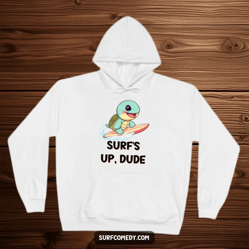 Cute sea turtle character with a massive grin surfing a surfboard, featured on a warm and funny hoodie.