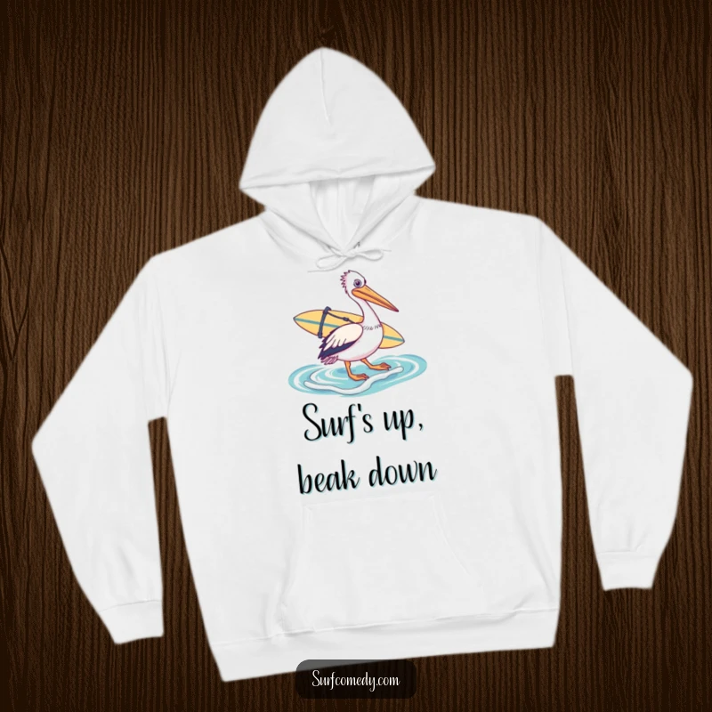 Funny hoodie featuring a pelican equipped with a surfboard, walking towards the ocean, promising warmth and humorous beach adventures.