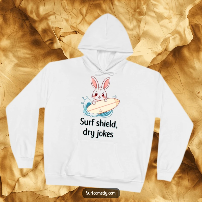 Funny hoodie featuring a rabbit using a surfboard as a shield from a playfully splashing ocean wave.