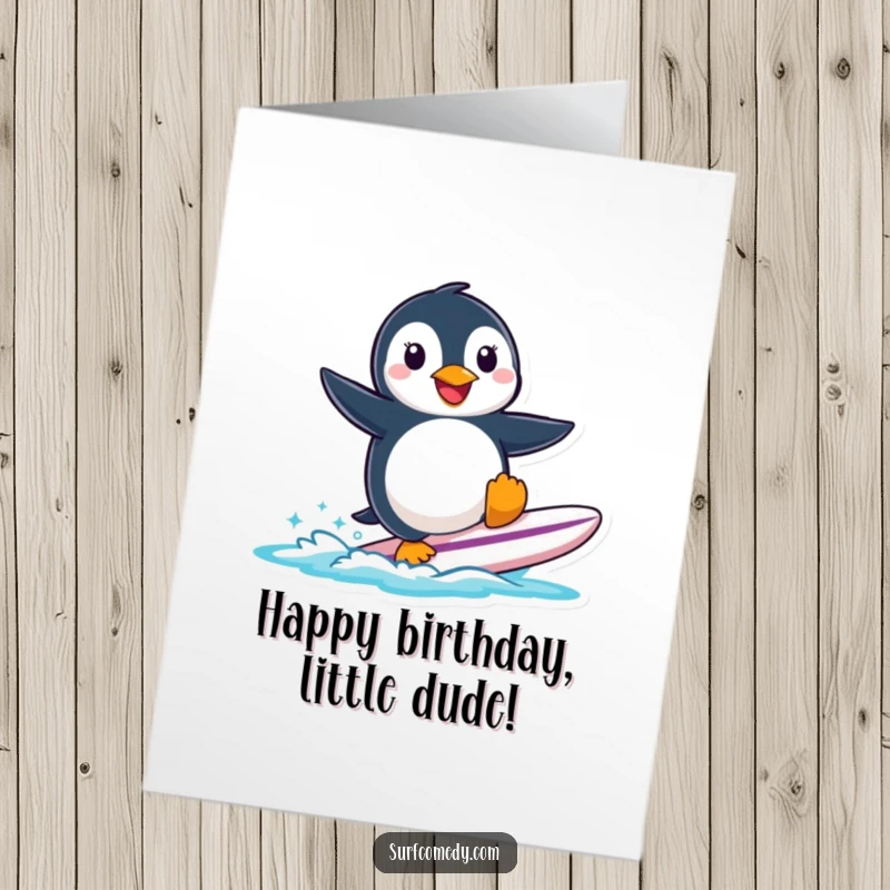Funny free printable birthday card of a smiling penguin precariously balancing on a small surfboard, ready to celebrate.