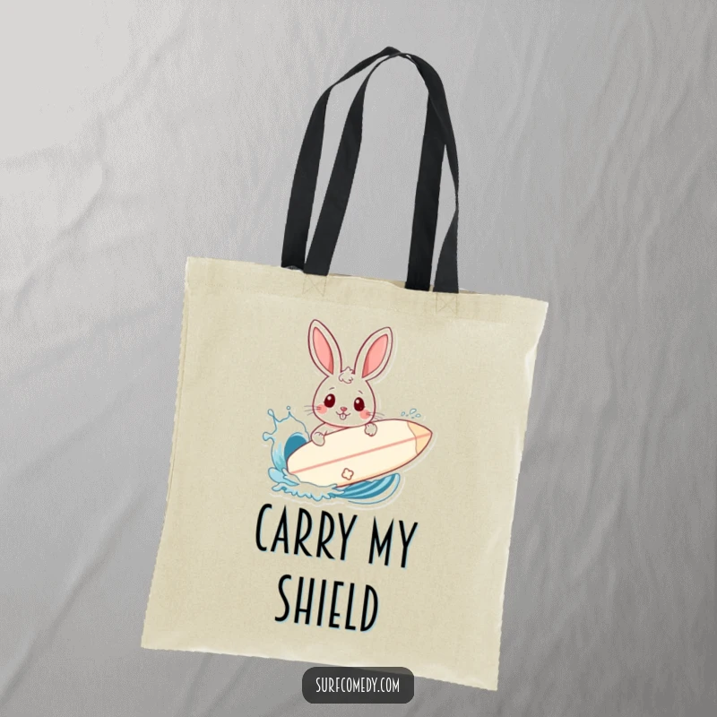 Funny tote bag showing a rabbit using a surfboard as a shield against a playful wave splash at the beach.