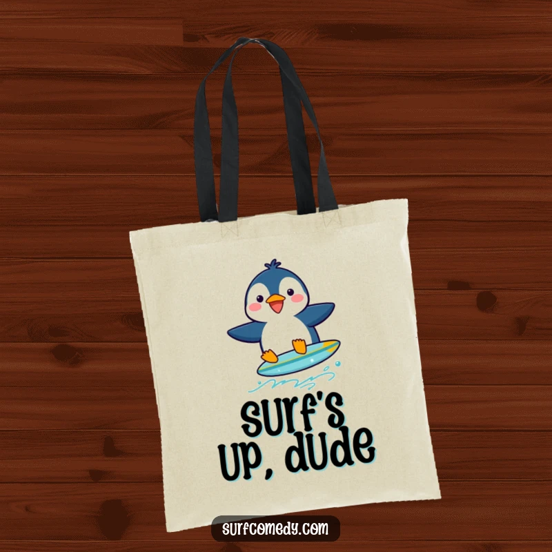 Funny penguin character attempting to surf on a very small surfboard, presented on a tote bag.